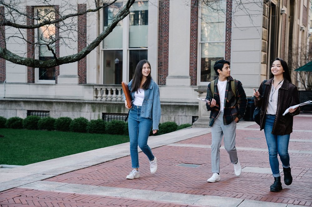 Students walking and talking together on campus
